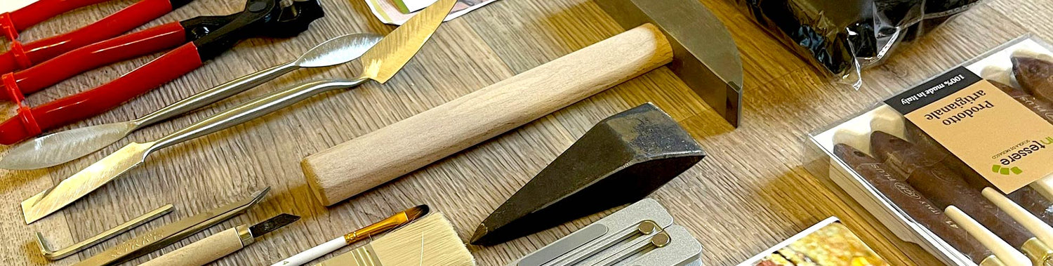 tool for mosaic art: hardie, hammer, cutter, spatulas